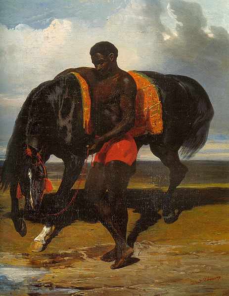 Africain tenant un cheval au bord d